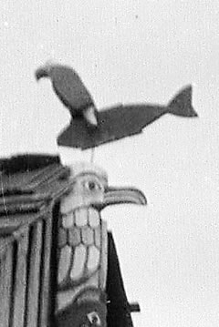 Close up of the eagle figure on top of the totem pole