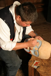 David Knox carving a mask