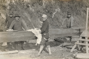 Visitors from Chemainus polish their canoe in preparation for a First Nations canoe race in the early 1900s