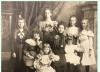 Piano teacher Selina Smith surrounded by her young students. 